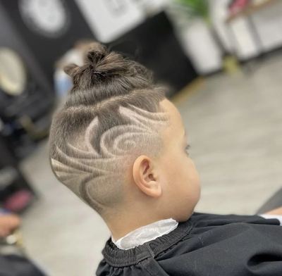 Custom swirl hair design cut into a fade