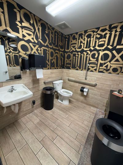 Gold Blended Craft mural lettering in the studio restroom