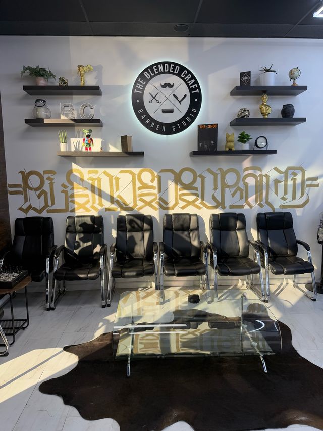 Waiting area with gold Blended Craft logo wall lettering and chairs